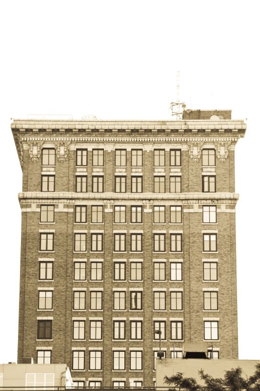 Terra-cotta cornice and upper brick stories of the building